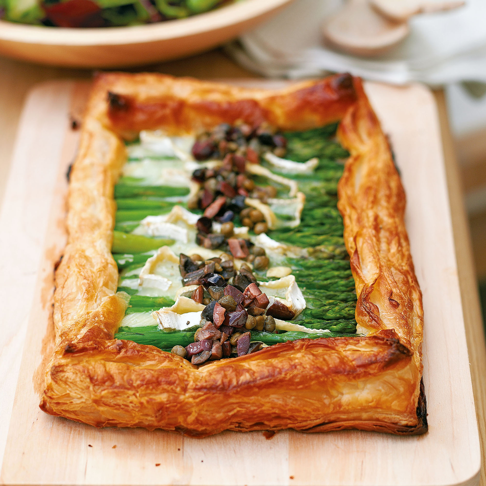 Asparagus tart with Brie and black olive dressing recipe Asparagus tart with Brie and black olive dressing recipe