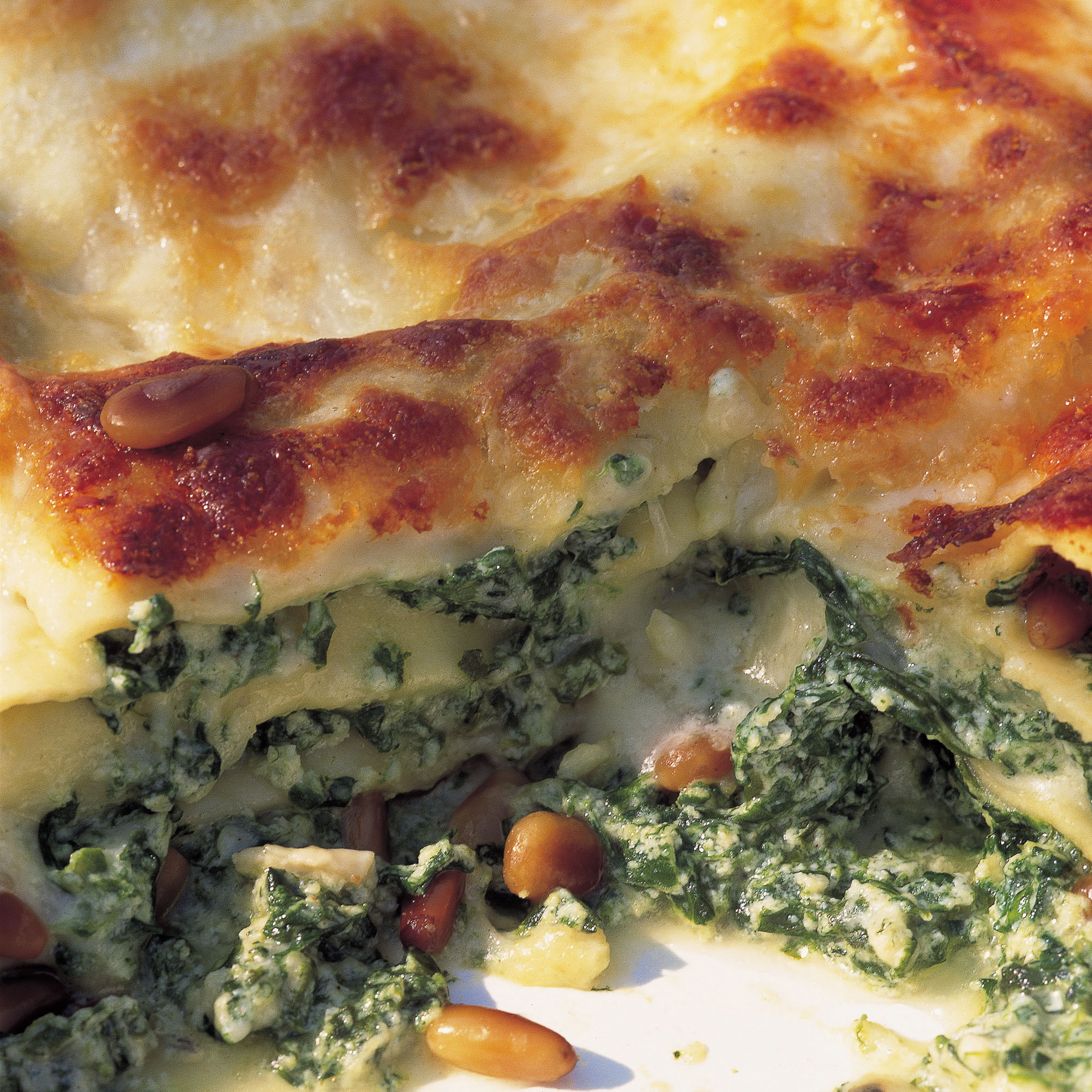Spinach and ricotta lasagne with pine nuts