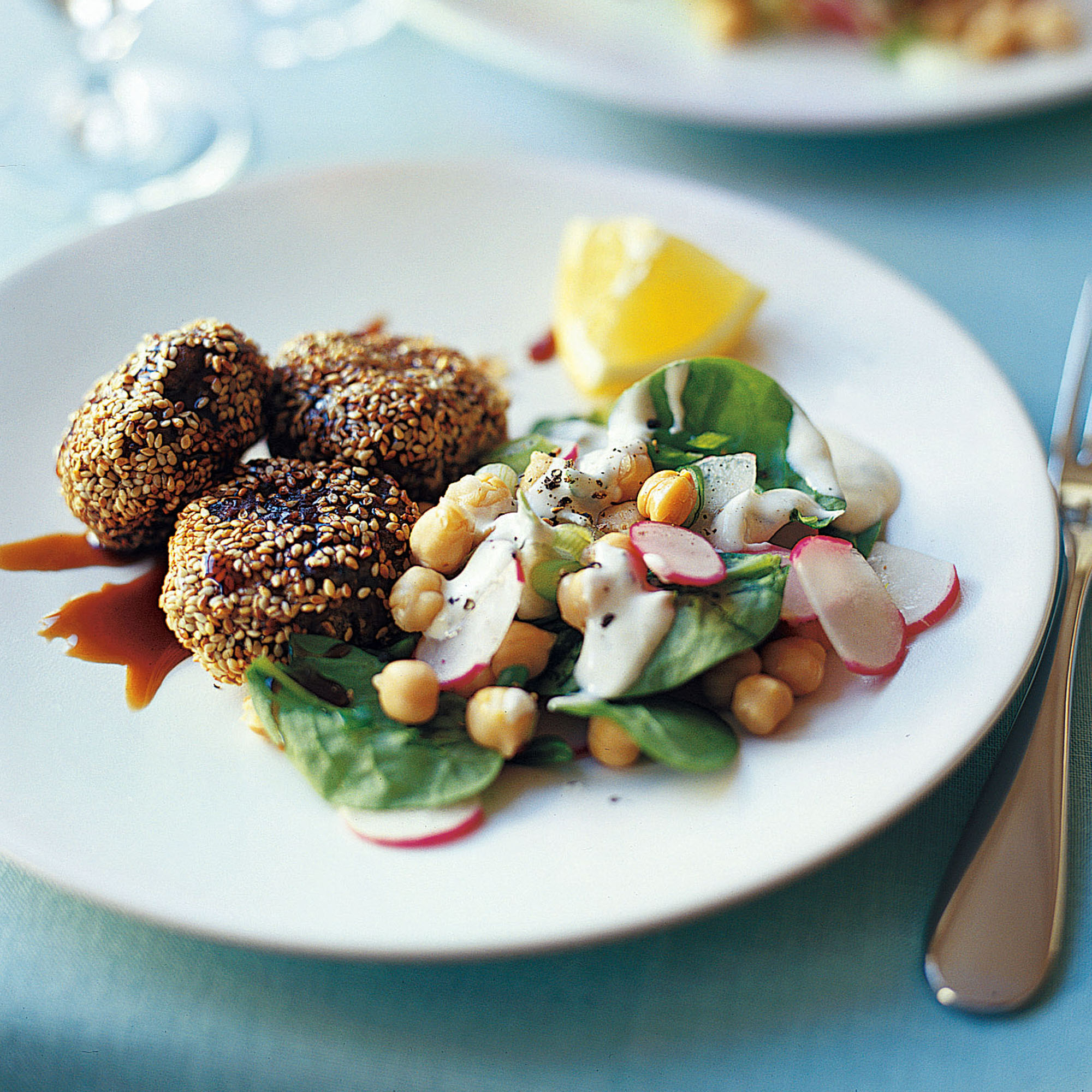 Sesame lamb patties with chickpea and spinach salad recipe Sesame lamb patties with chickpea and spinach salad recipe