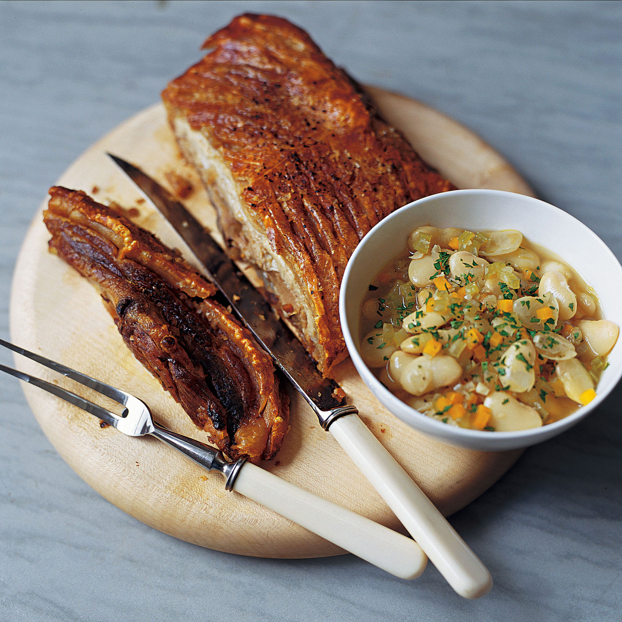 Crispy belly pork with sage butterbeans recipe