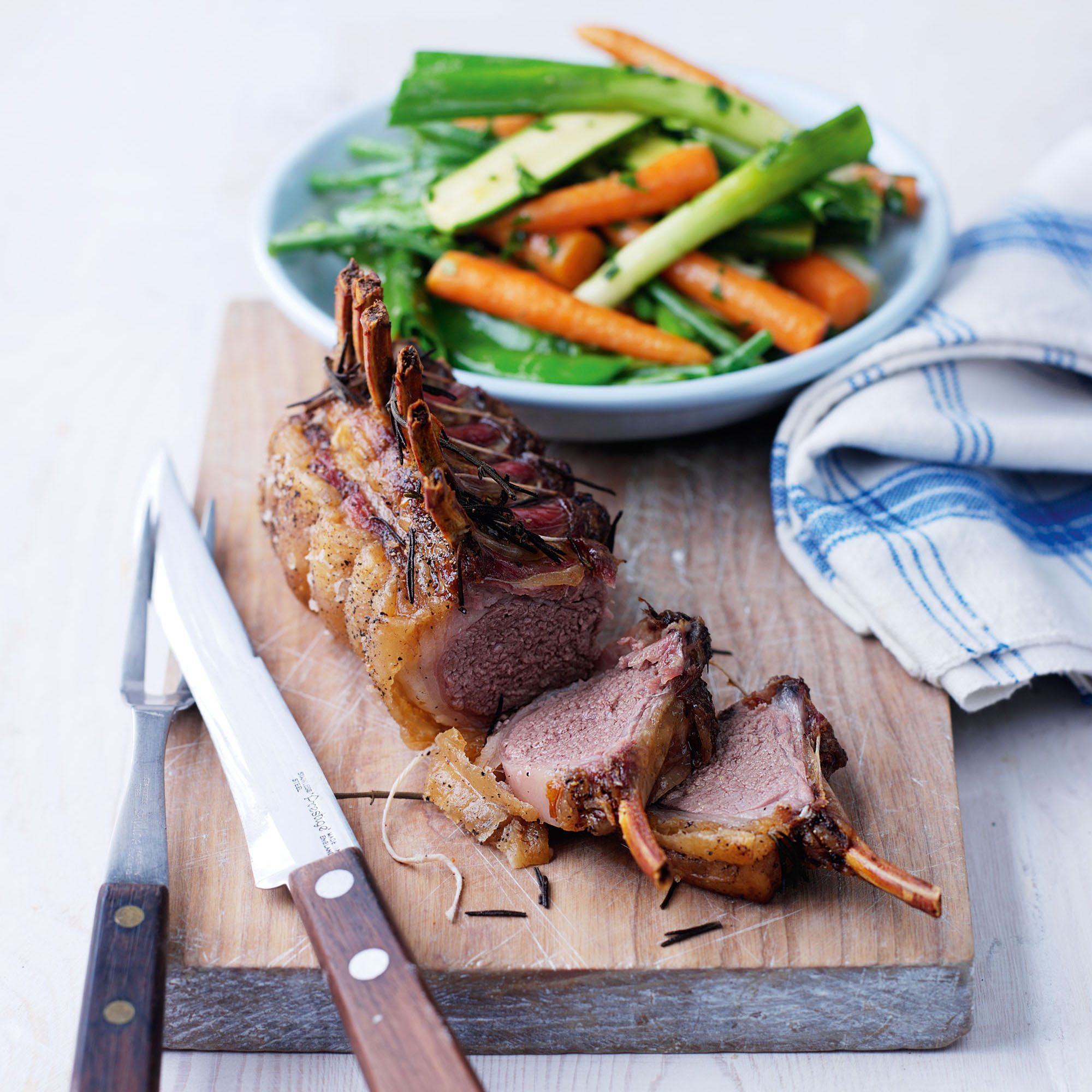 Roast rack of lamb with spring veg and hot herby dressing recipe Roast rack of lamb with spring veg and hot herby dressing recipe