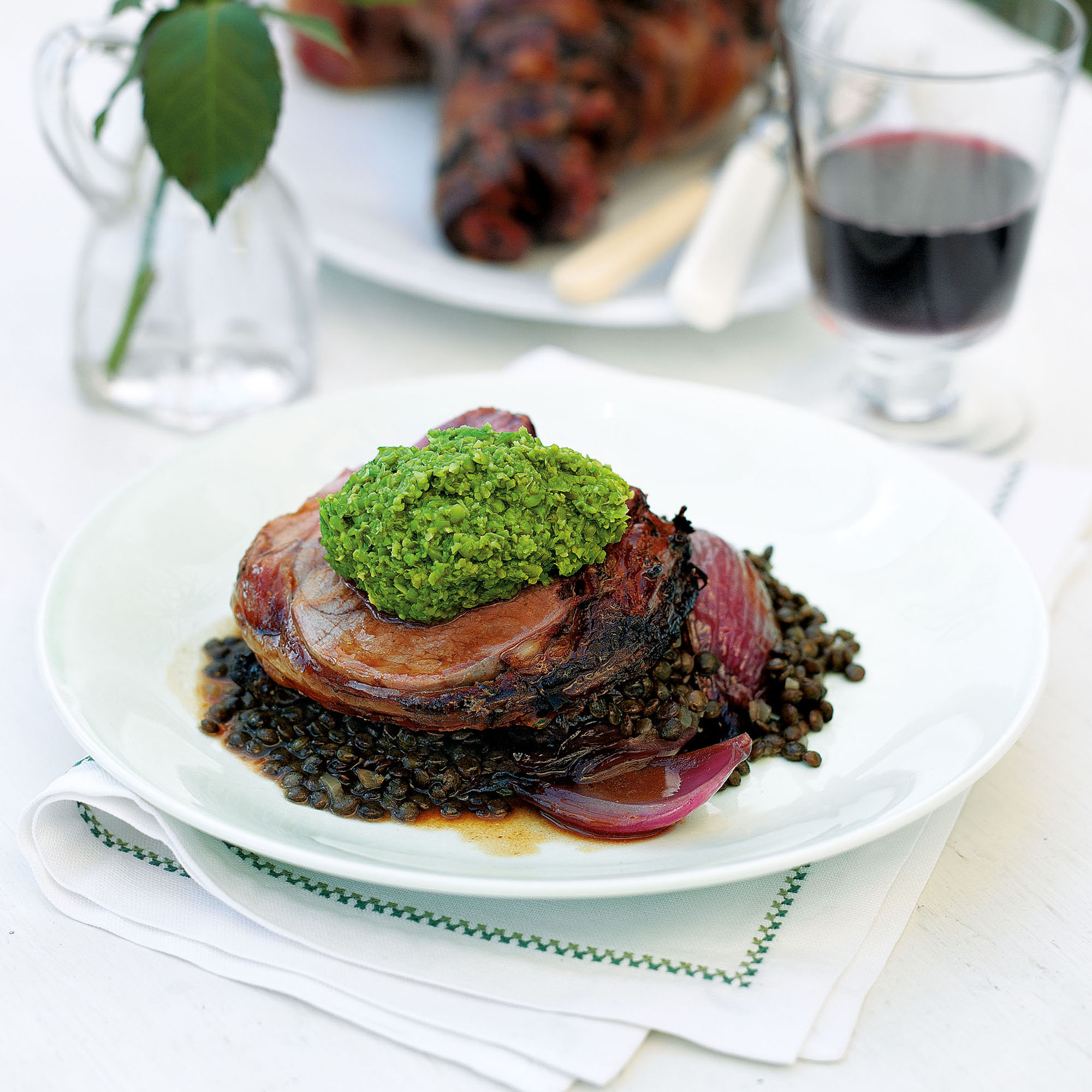 Boned garlic lamb with sweet and sour red onions and lentils recipe Boned garlic lamb with sweet and sour red onions and lentils recipe