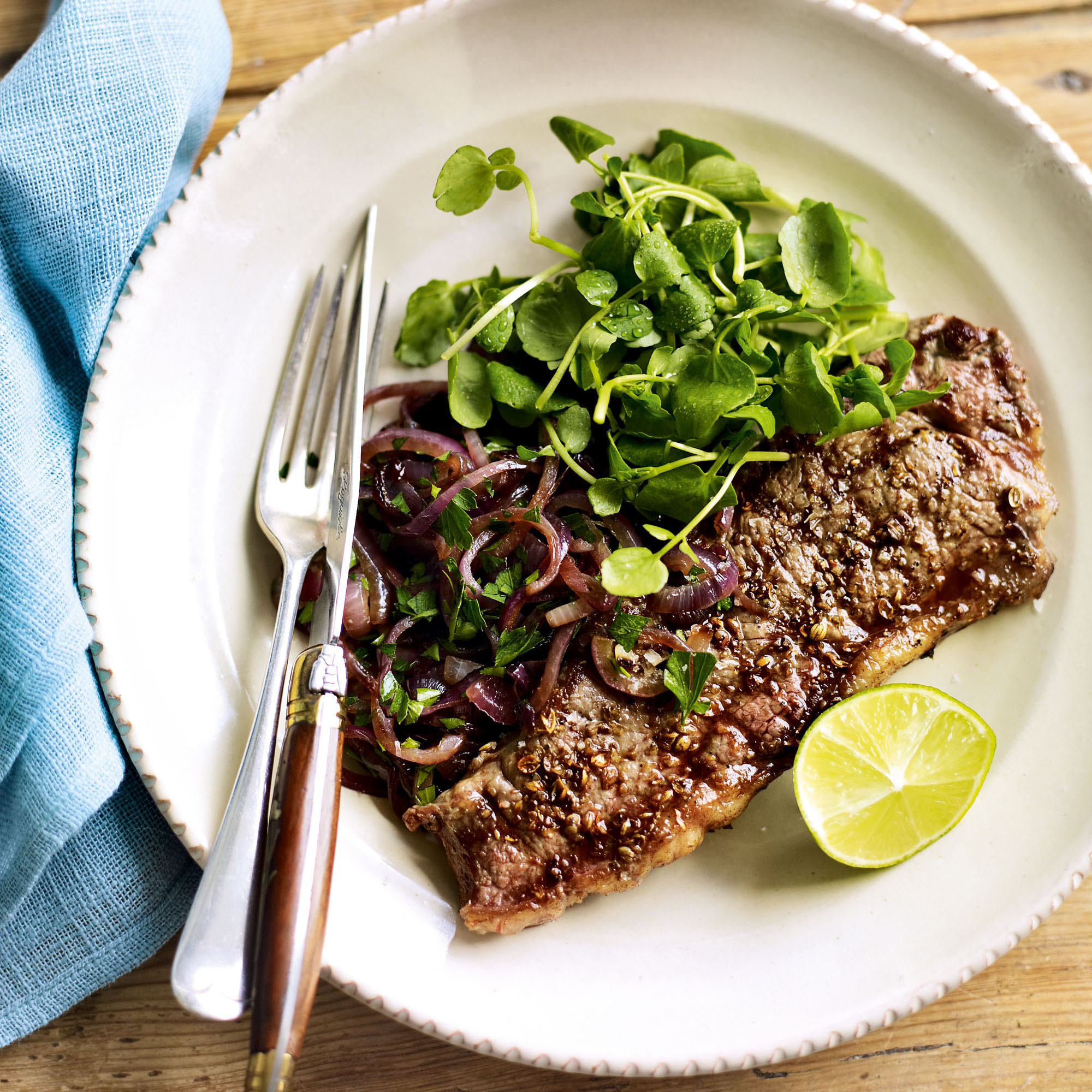 Coriander-rubbed steaks with sautéed red onions and watercress recipe Coriander-rubbed steaks with sautéed red onions and watercress recipe