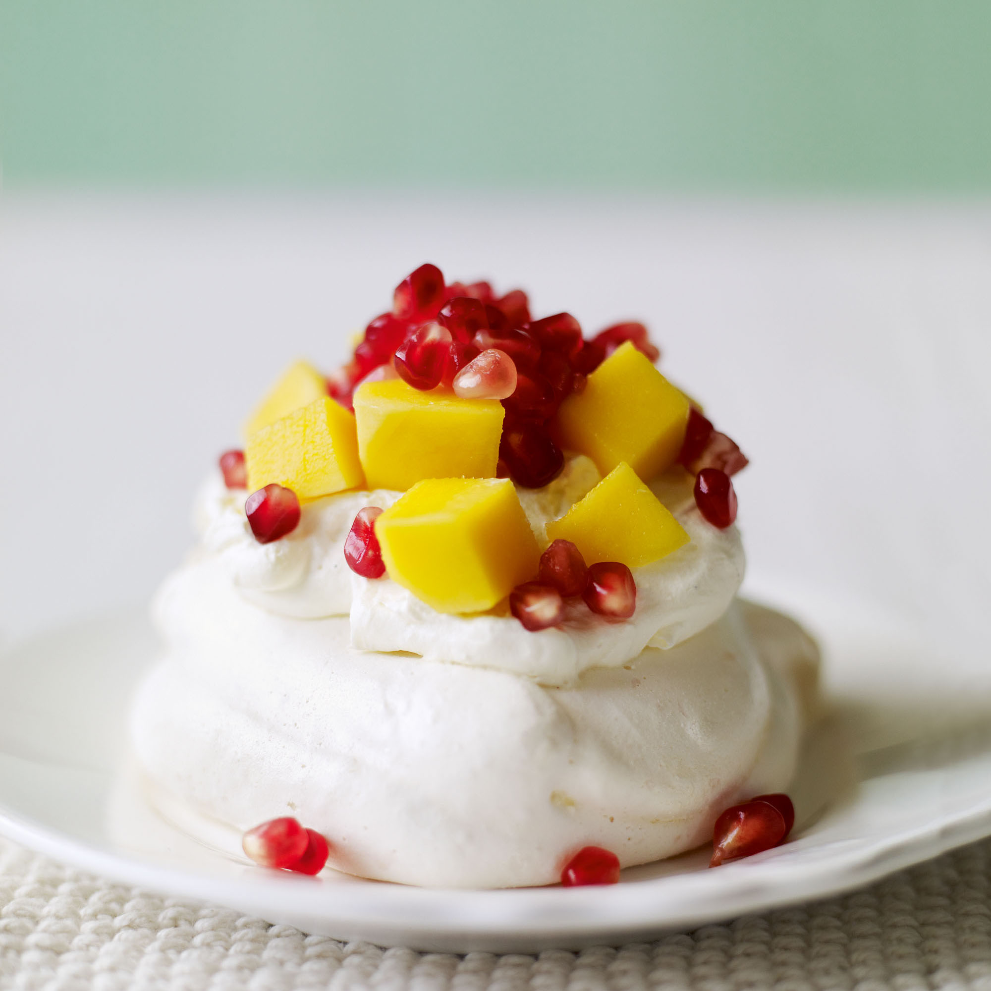 Mini Pavlovas with pomegranate and mango recipe Mini Pavlovas with pomegranate and mango recipe
