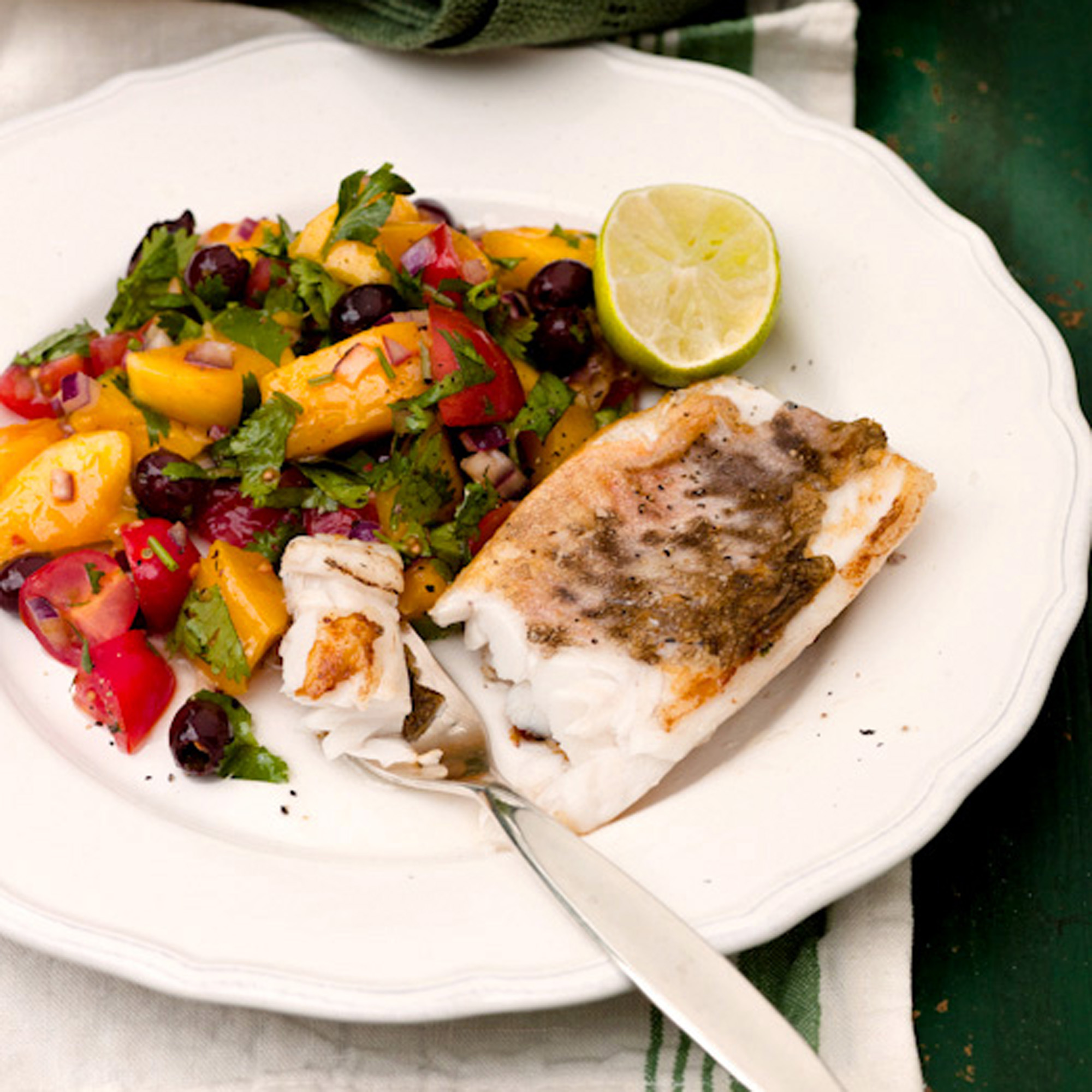 White fish with mango, black olive and tomato salsa recipe