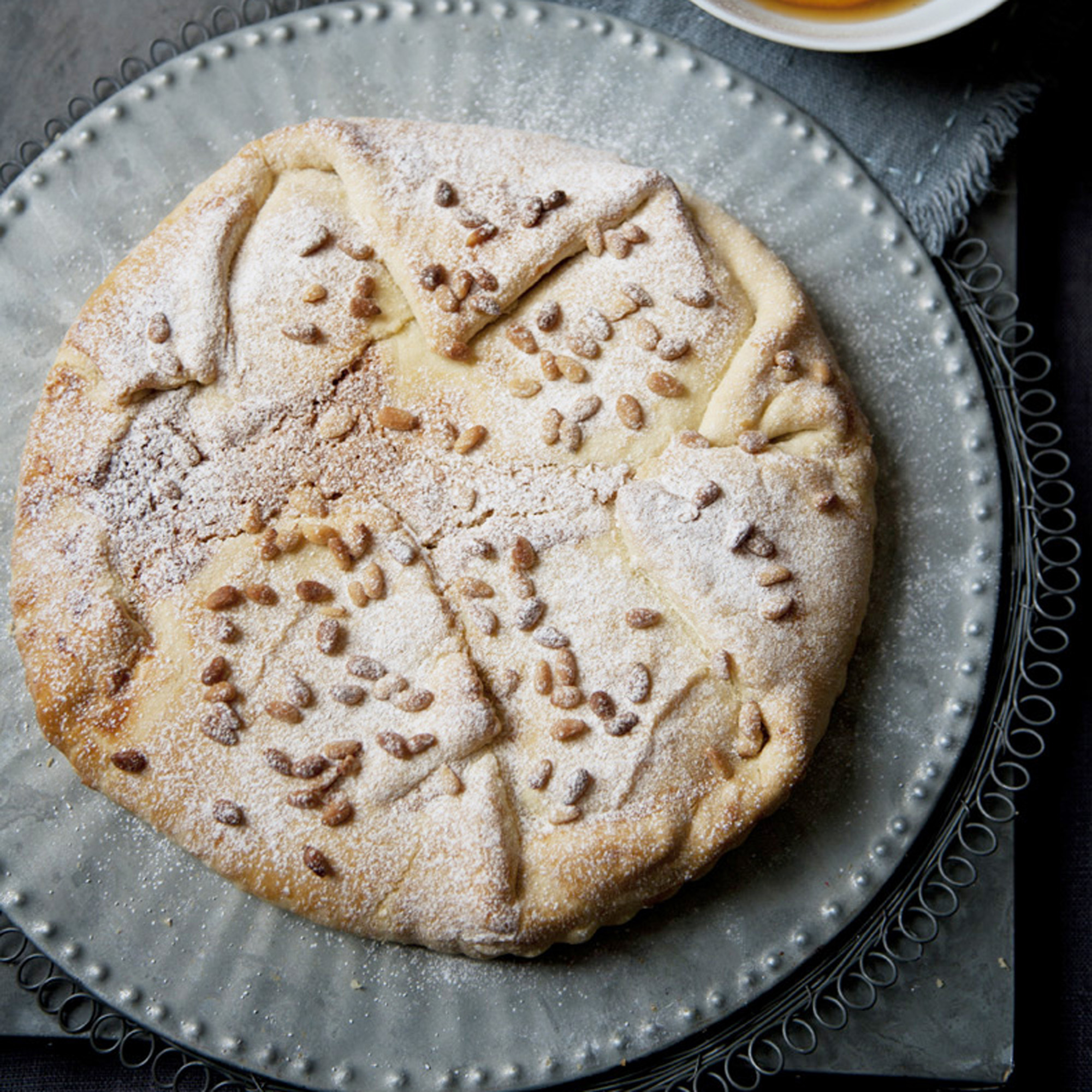 Toasted pine nut tart with clementine syrup recipe Toasted pine nut tart with clementine syrup recipe