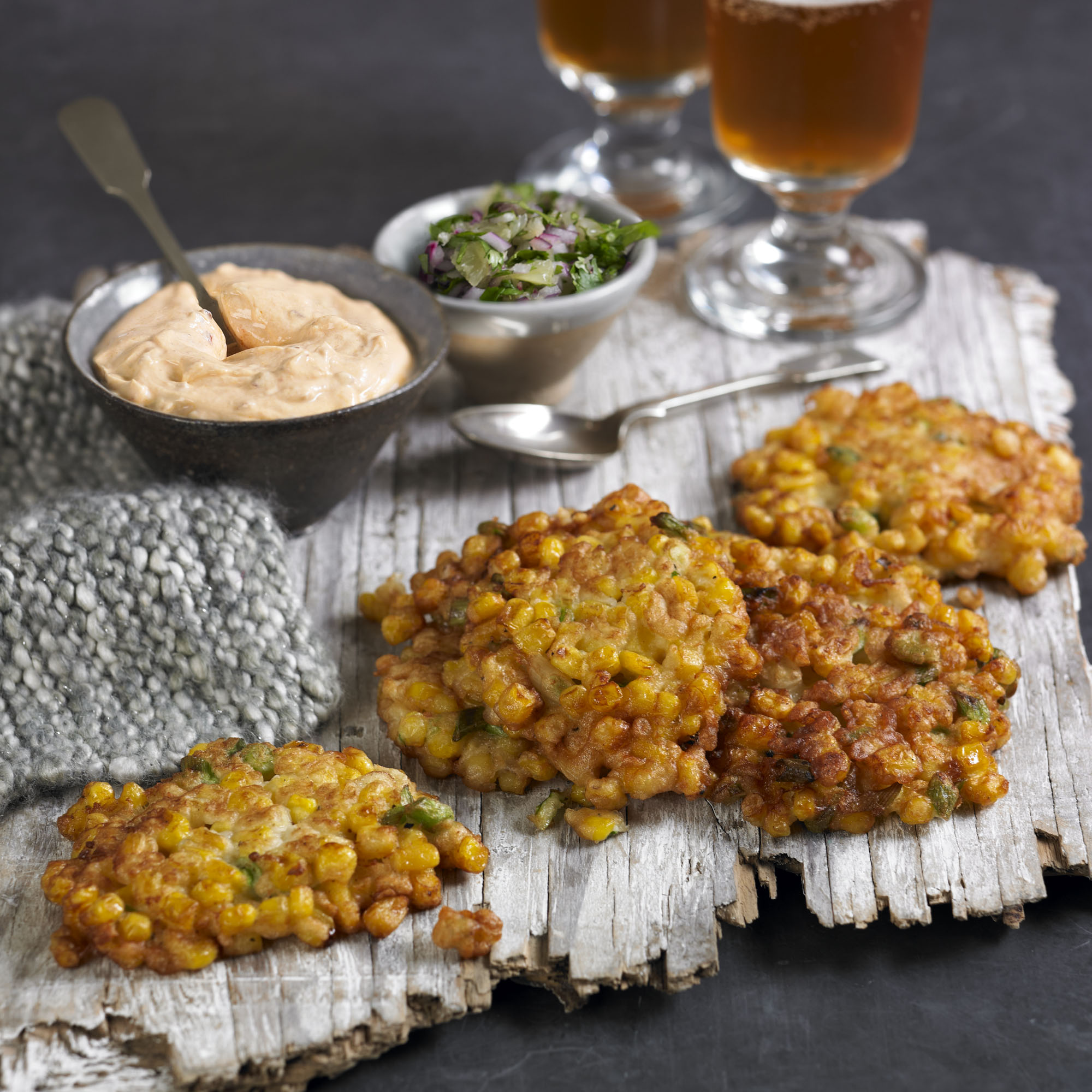Sweetcorn fritters with harissa yogurt and lime salsa recipe