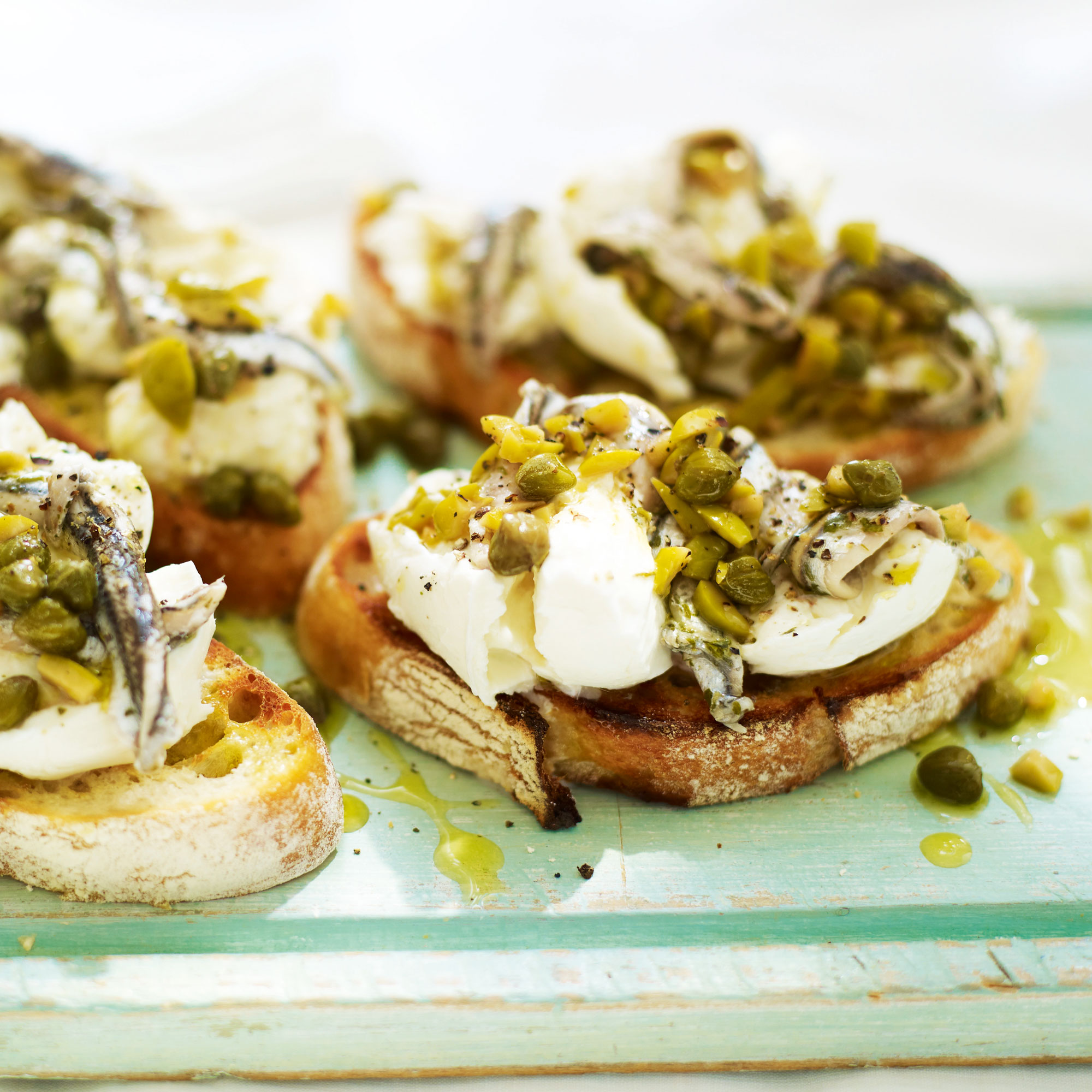 Buffalo Mozzarella with Anchovies, Olives and Capers on Sourdough