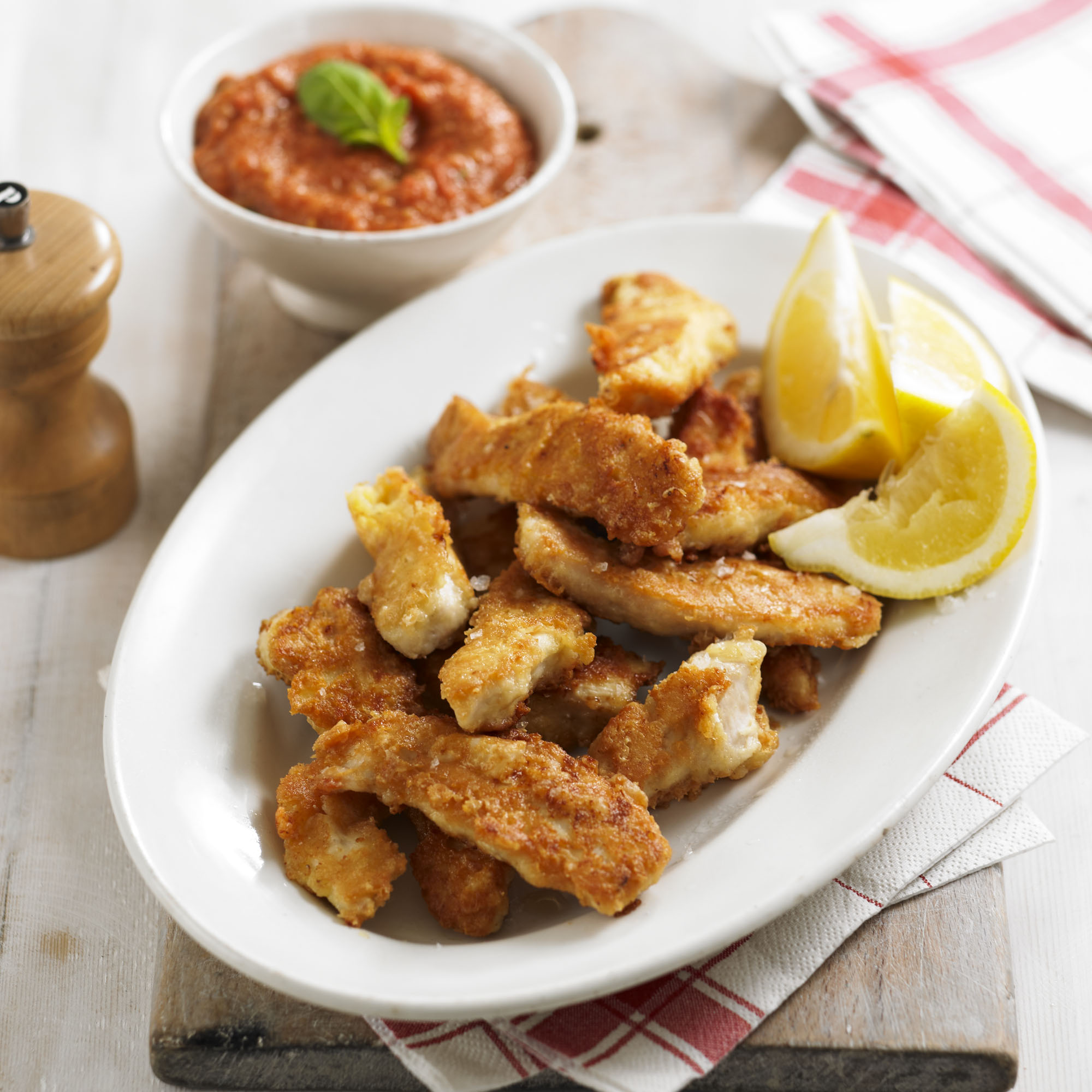 Parmesan chicken goujons with roasted tomato and garlic dipping sauce recipe Parmesan chicken goujons with roasted tomato and garlic dipping sauce recipe