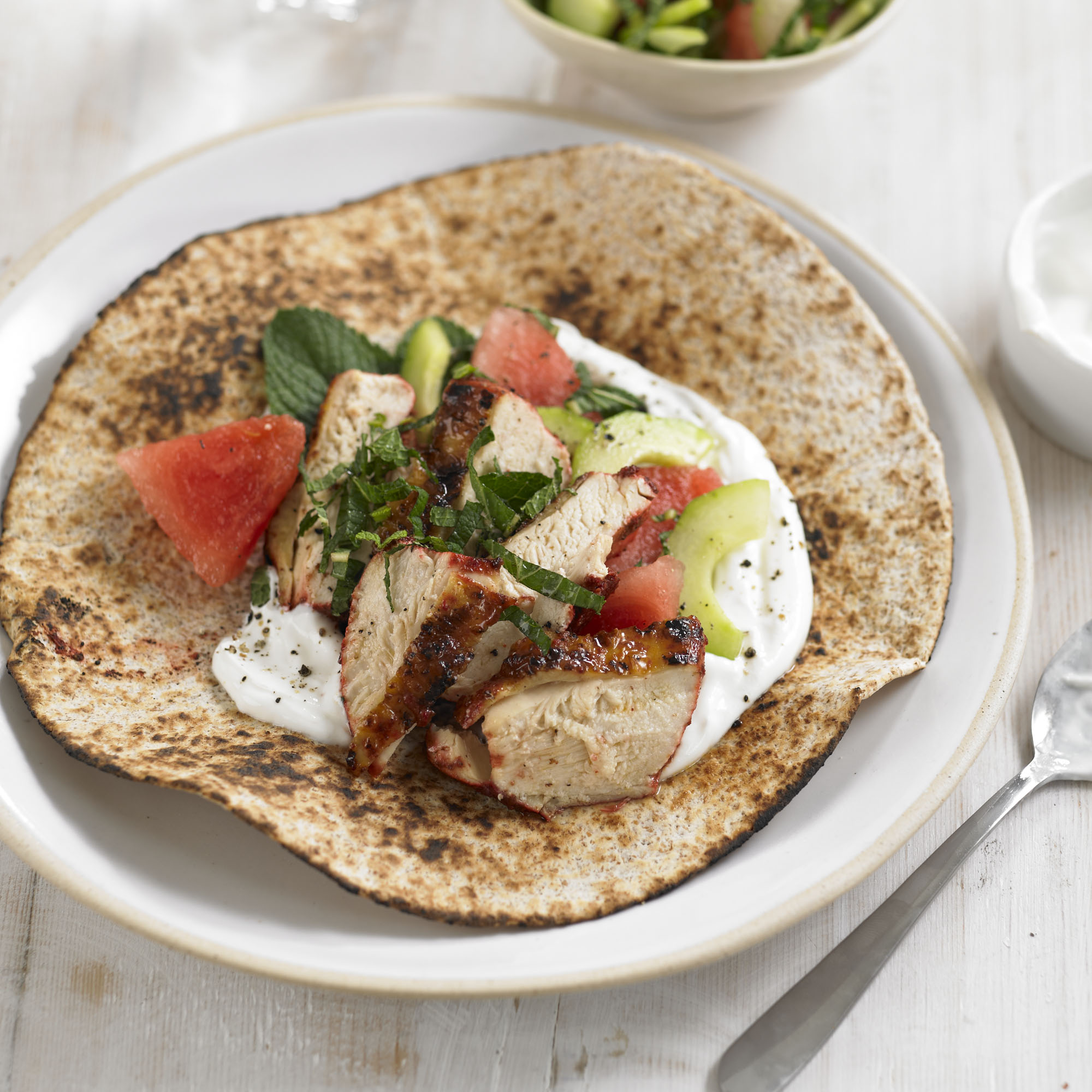 Tandoori chicken flatbreads with watermelon and mint salad recipe Tandoori chicken flatbreads with watermelon and mint salad recipe