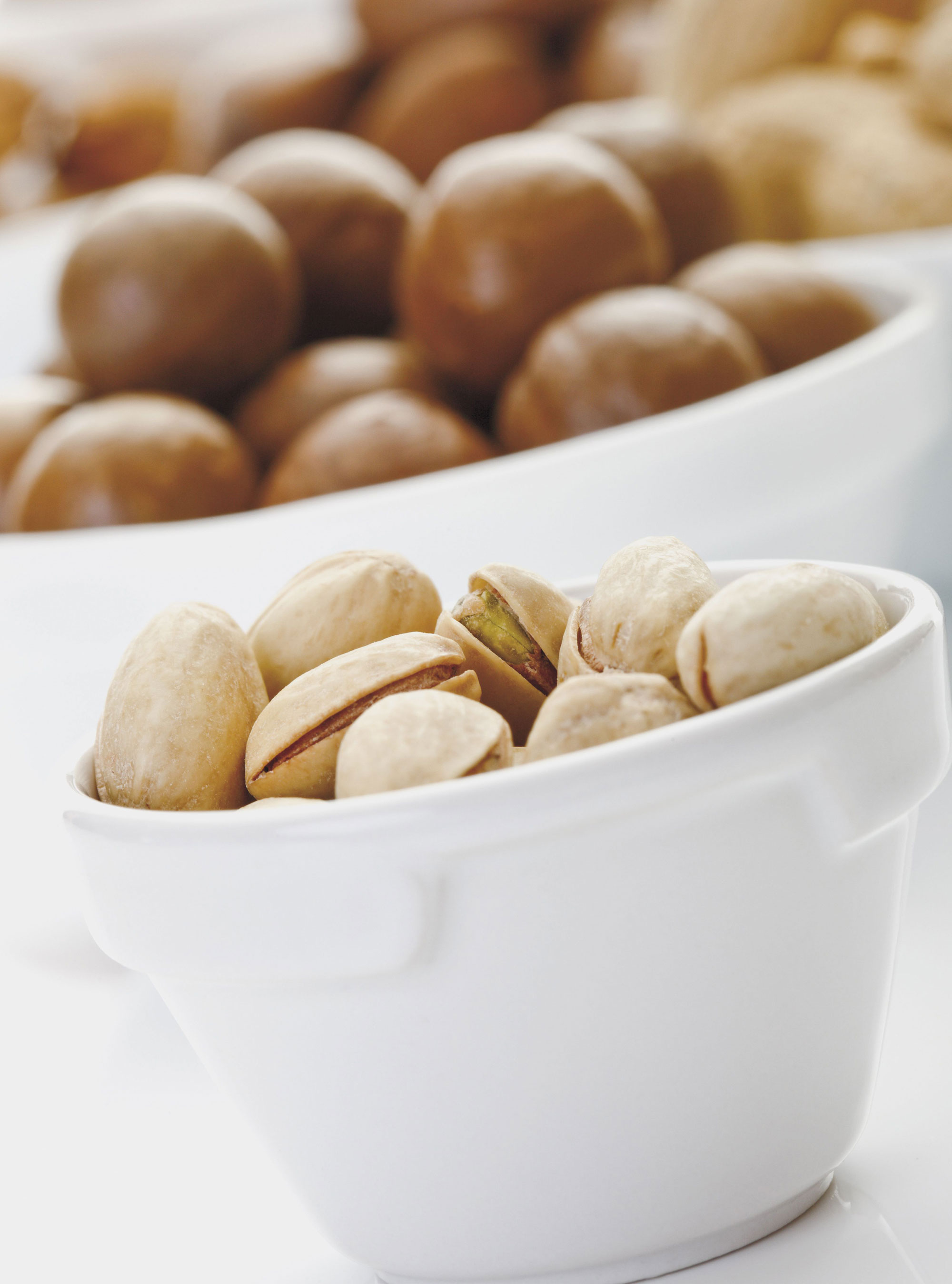 They eat zinc-rich foods bowls of nuts photo