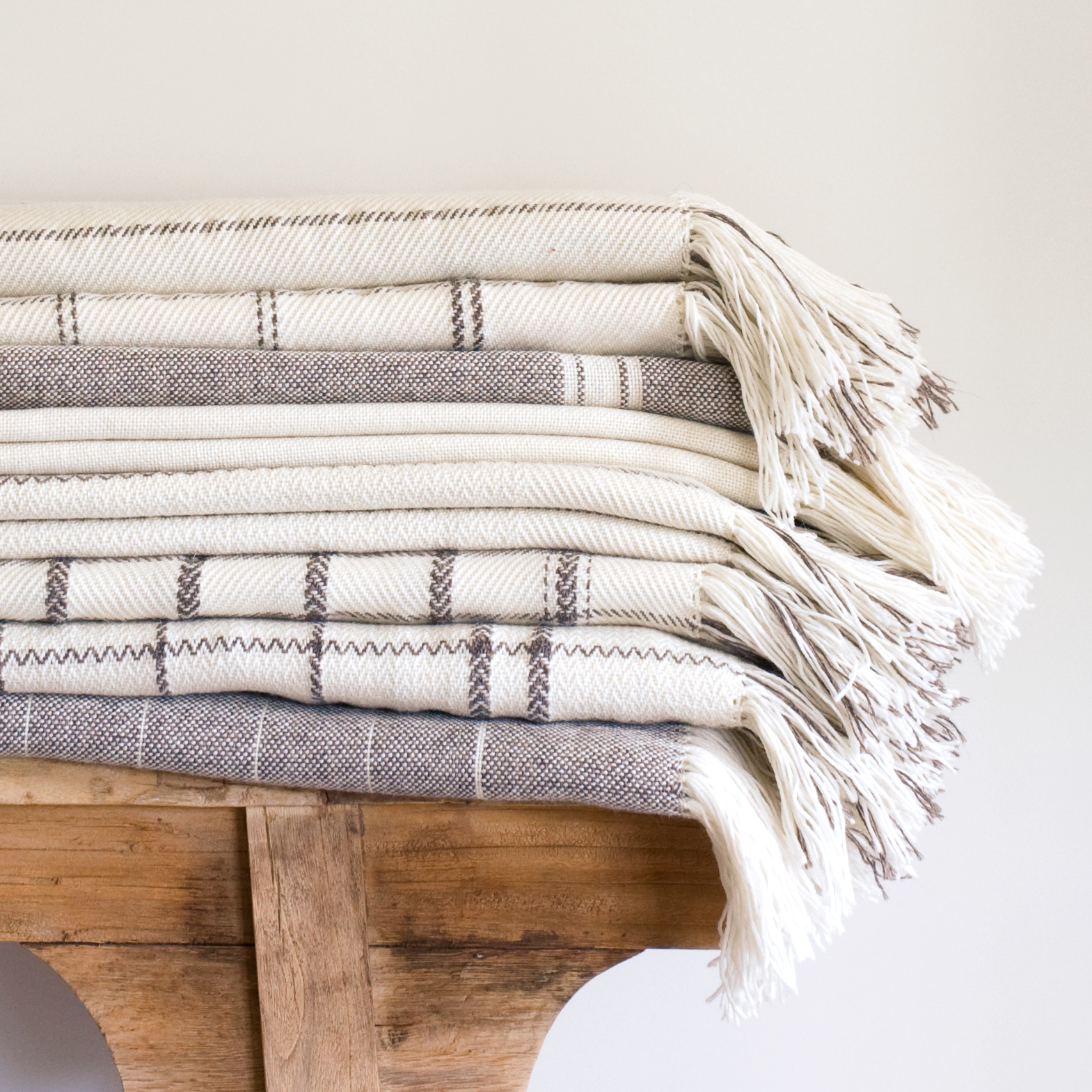 Pure-Lana---Plain-weave-twill-throws-stack---hi-res