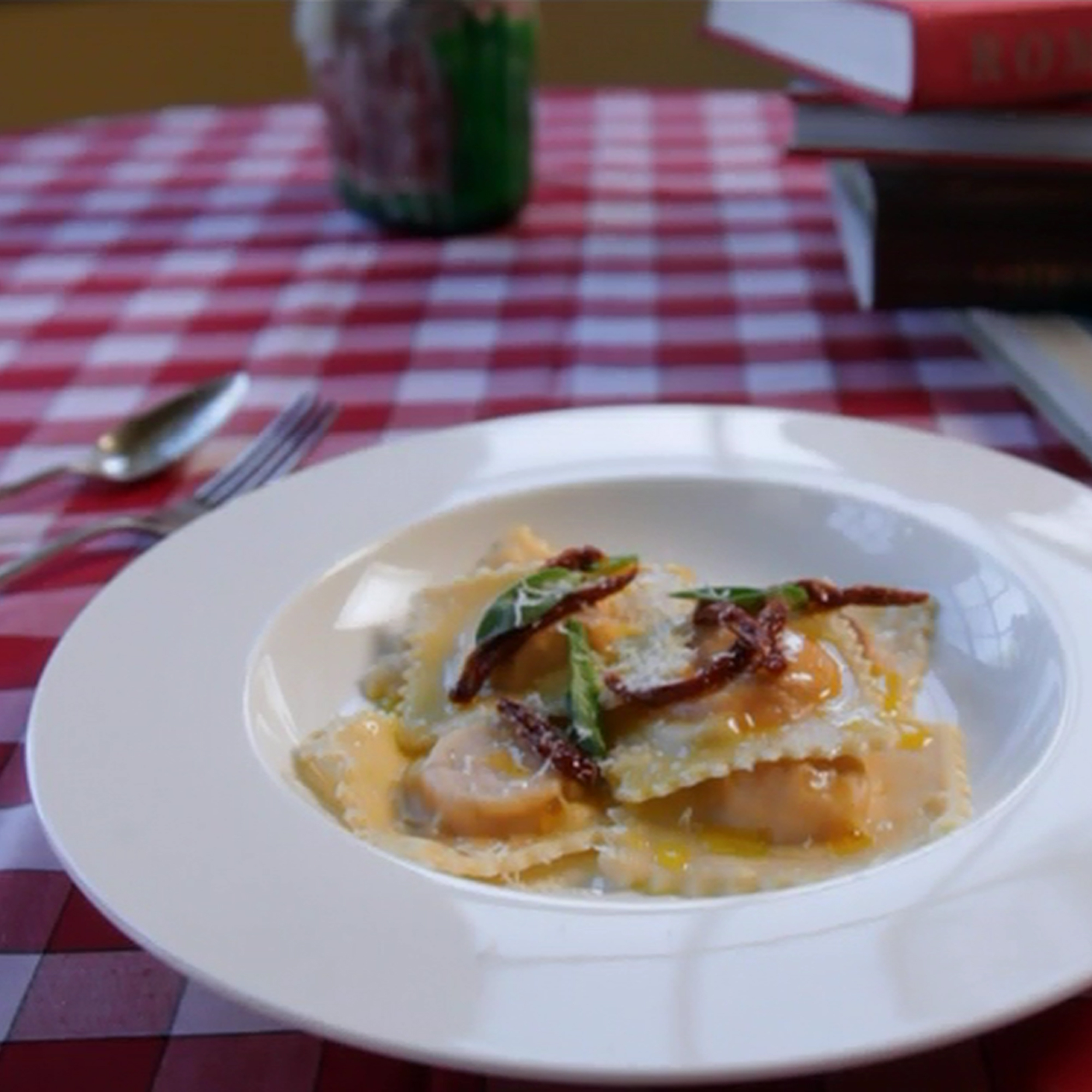 Butternut squash ravioli with fried sage leaves and sun-dried tomatoes