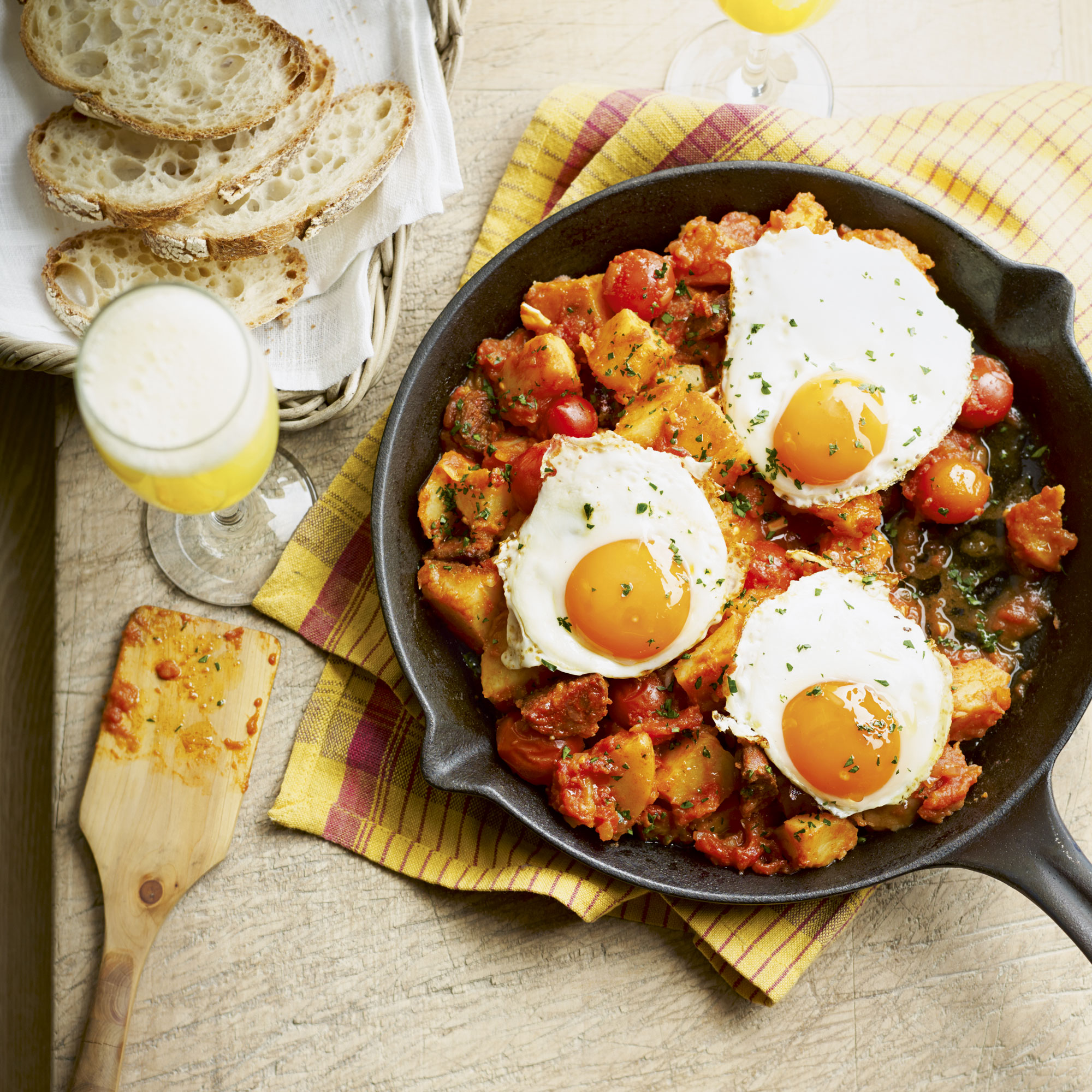 Chorizo and patatas bravas with eggs Chorizo and patatas bravas with eggs