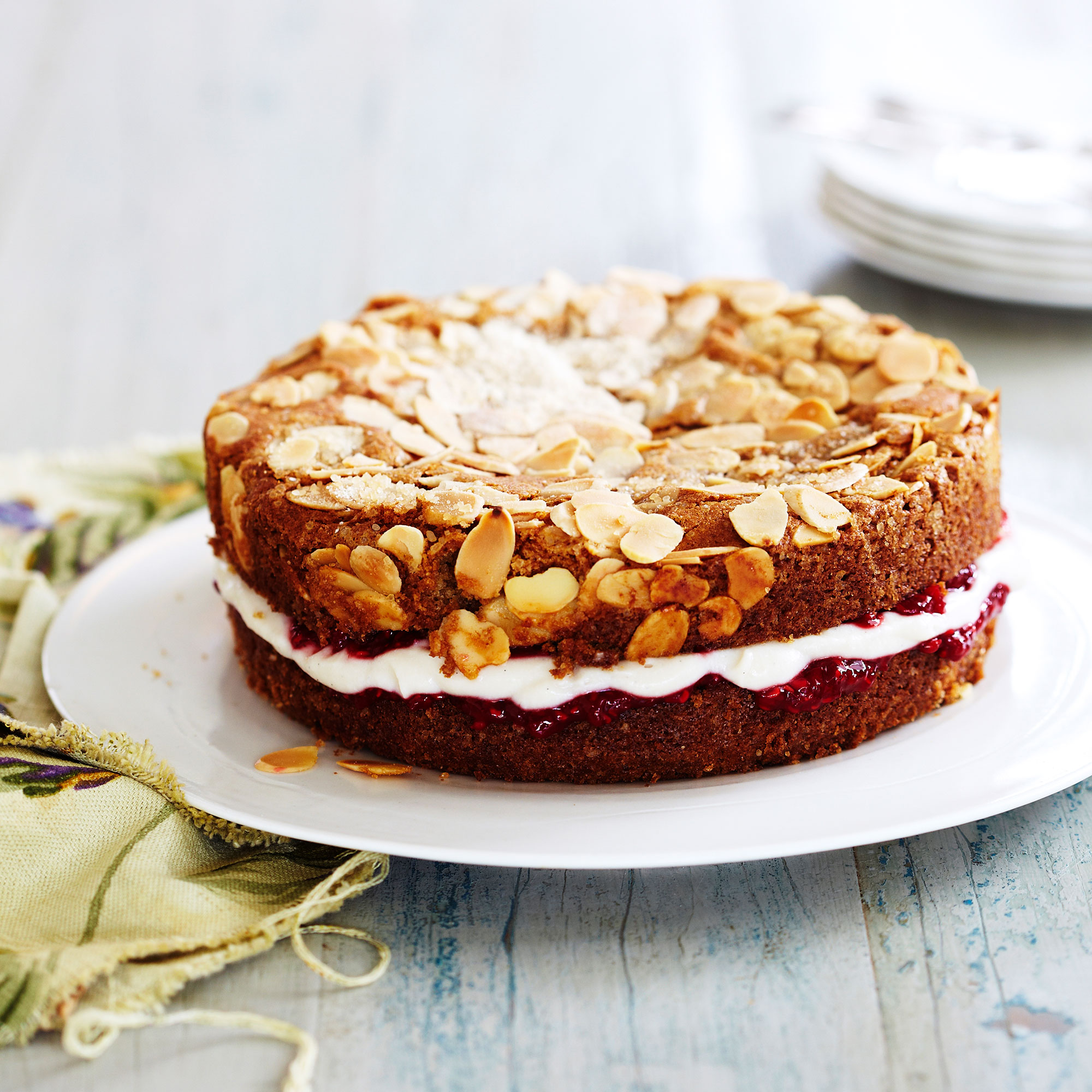 Vanilla and almond cake with almond cream and raspberry jam Vanilla and almond cake with almond cream and raspberry jam