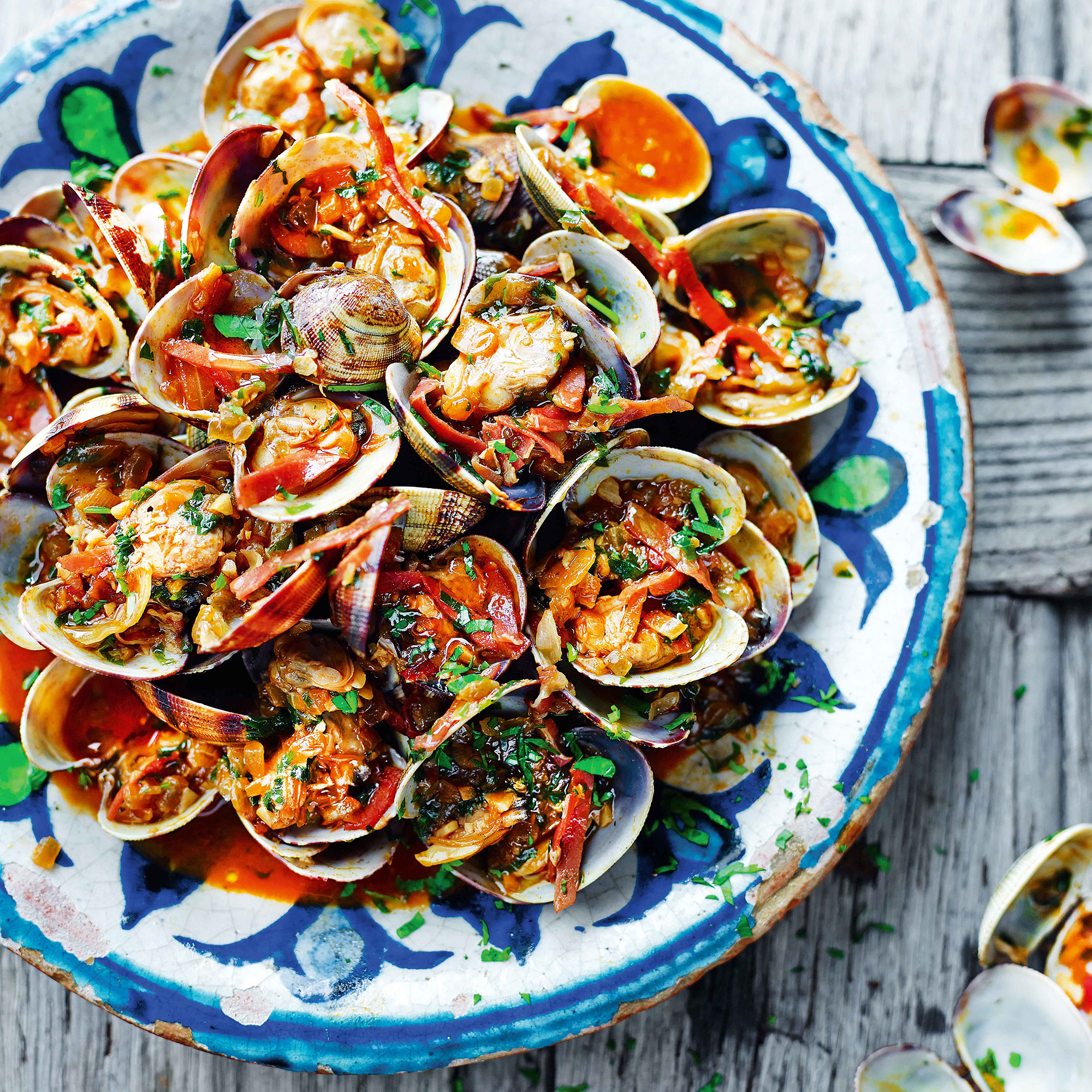 Entertaining this weekend? Take inspiration from Spain and tuck in to a tempting tapas feast of clams with sherry and serrano ham, Moorish pork skewers and patatas bravas...