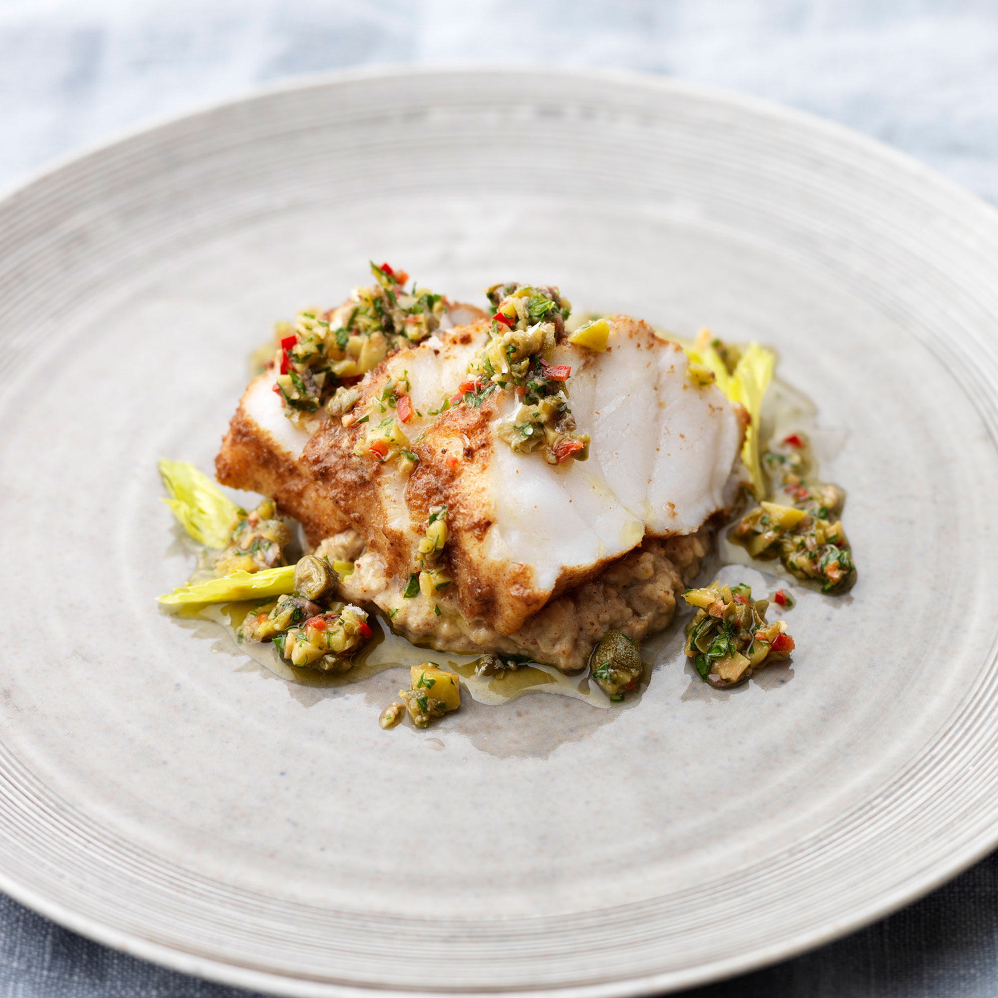 Spiced monkfish and aubergine puree with green olive dressing Spiced monkfish and aubergine puree with green olive dressing